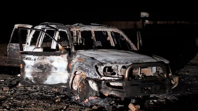 The remains of a car reportedly used by the gunmen who attacked a bus carrying Coptic Christians. AFP