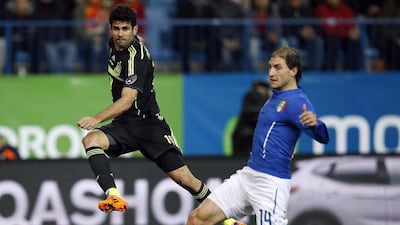 Diego Costa fires a shot during his Spain debut on Wednesday against Italy. Paul Hanna / Reuters