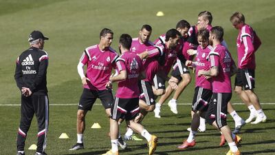 Real Madrid players train ahead of their match against Rayo Vallecano as coach Carlo Ancelotti keeps a watchful eye. J J Guillen / EPA