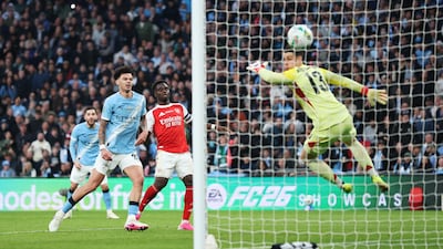 Nico O'Reilly scores the second goal past Kepa Arrizabalaga of Arsenal. Getty Images