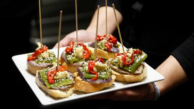 Depending on the number of guests and vibe you want to set, choose from canapes, a buffet or a sit-down dinner. Getty Images