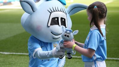 Moonbeam the Manchester City mascot greets a young fan prior to the Premier League match between Manchester City and Arsenal at the Etihad Stadium on May 8, 2016 in Manchester, England. (Alex Livesey/Getty Images)