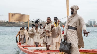 Models pose on a pirogue with clothes by designer Service Almakhtoum before the final show of Dakar Fashion Week, in Ngor Bay, Senegal. AFP