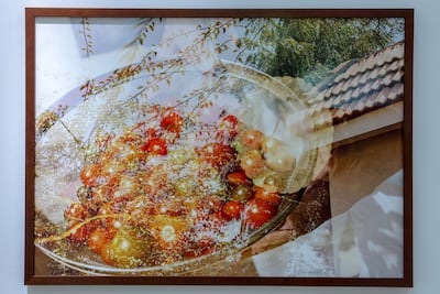 Al Zaabi's images combine photographs of interiors and exteriors of homes, overlaid and interwoven. Victor Besa / The National