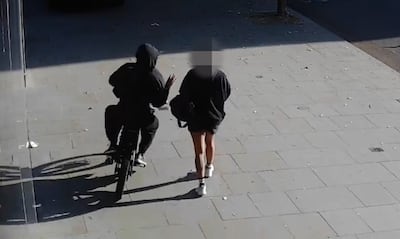 A mobile phone being snatched in London. Photo: Metropolitan Police