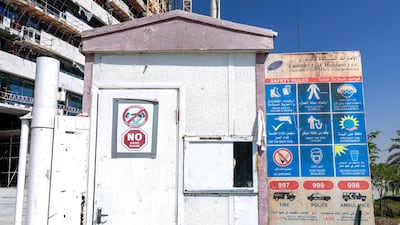Abu Dhabi City Municipality officers on a safety inspection at a under-construction site in Al Raha. Victor Besa / The National