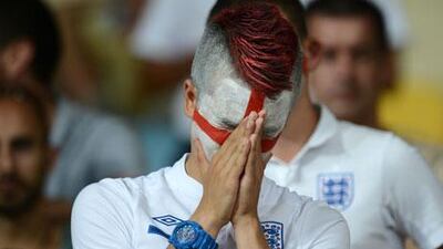 A fan shows his dejection after England lose on penalties to Italy at Euro 2012.