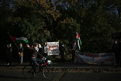 Supporters of alleged Palestine Action activists accused of breaking into Elbit Systems' Bristol site outside Woolwich Crown Court in London during their trial. AFP
