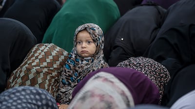 A Palestinian girl attends Eid Al Adha prayer in Gaza City. EPA