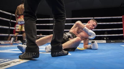 Carl Frampton of Northern Ireland knock off balance by Jamel Herrinng of United States against Jamel Herring of USA at the Rotunda, Ceasar's Palace, Bluewaters Island, Dubai. Leslie Pableo for The National