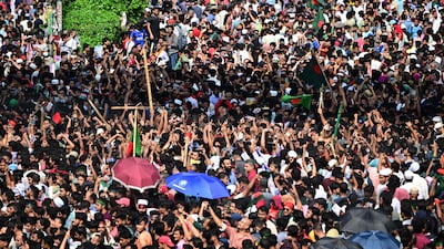 Anti-government protestors celebrate in Shahbag near Dhaka university area in Dhaka on August 5, 2024. Protests in Bangladesh that began as student-led demonstrations against government hiring rules in July culminated on August 5, in the prime minister fleeing and the military announcing it would form an interim government. (Photo by Munir UZ ZAMAN / AFP)