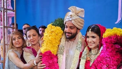 Guests bless the newly-weds after their pheras