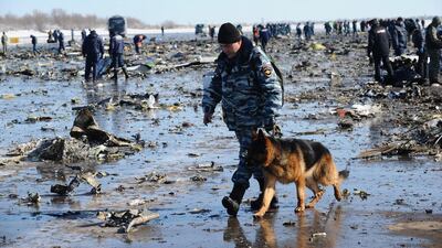 Russian Police and Emergency Ministry employees investigate the wreckage of the crashed plane at the Rostov-on-Don airport. Investigators were to spend the day combing the scene for clues of what caused the crash. The plane’s black boxes were flown to Moscow late Saturday for examination by experts from Russia, the UAE, France and the US. AP Photo