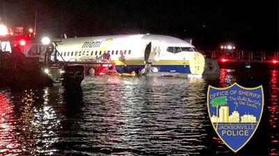 Authorities work at the scene of a plane in the water in Jacksonville, Florida. Jacksonville Sheriff's Office via AP