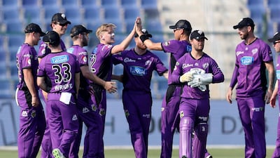 Nathan Ellis (without cap) of Hobart Hurricanes celebrating after taking the wicket of Bilal Irshadi.