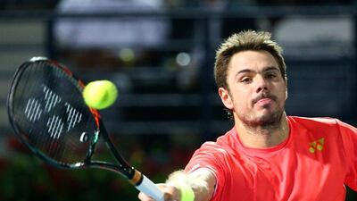 Swiss Stan Wawrinka returns the ball to Ukrainian Sergiy Stakhovsky during their ATP tennis match on the second round of the Dubai Duty Free Tennis Championships on February 23, 2016. / AFP / MARWAN NAAMANI