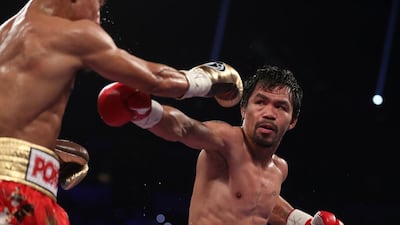 Manny Pacquiao, right, throws a right to the head of Jessie Vargas. Christian Petersen / Getty Images