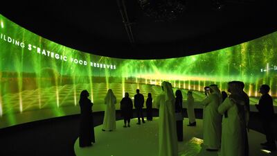 Participants watch a movie advertising Saudi's Red Sea project on the sidelines of the three-day Future Investment Initiatives conference in Riyadh, on October 25, 2017. / AFP PHOTO / FAYEZ NURELDINE
