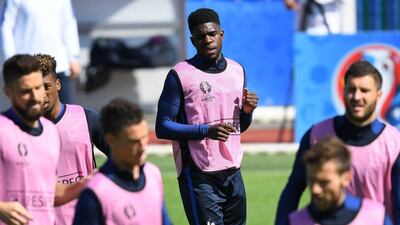 France defender Samuel Umtiti (C) warms up with teammates during a training session in Clairefontaine-en-Yvelines, southwest of Paris, on July 2, 2016, on the eve of the Euro 2016 quarter-final football match between France and Iceland. Franck Fife / AFP