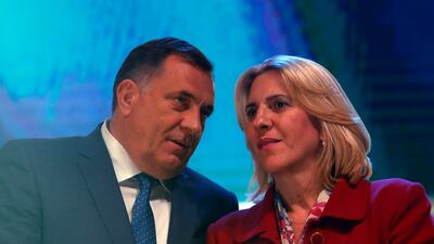 Milorad Dodik, left, a member of Bosnia-Herzegovina's tripartite presidency, speaks with the President of the Republika Srpska, Zeljka Cvijanovic, in October 2018. At that time, he was president of Srpska and she was prime minister. AP