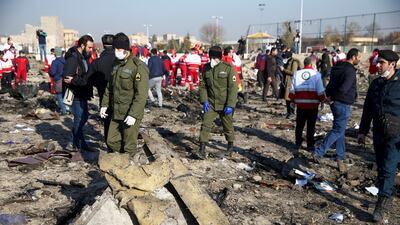 Security officers and Red Crescent workers at the site where the Ukraine International Airlines plane crashed after take-off from Iran's Imam Khomeini airport, on the outskirts of Tehran, Iran. Reuters