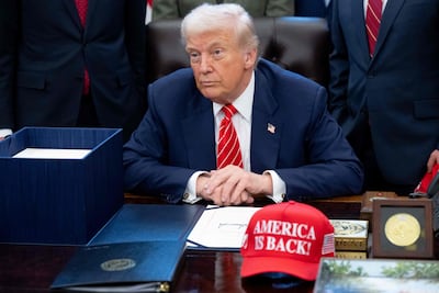 US President Donald Trump speaks with the media after signing a funding bill to end a partial government shutdown in the Oval Office of the White House in Washington. AFP