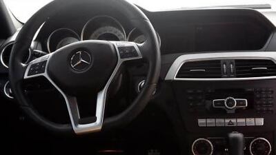 Abu Dhabi, United Arab Emirates, 2 June, 2012: Ayesha Al Khoori enjoys driving her red 2012 Mercedes C350. Story on Road Test. Asmaa Al Hameli / The National