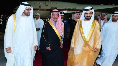 Saudi Arabia's deputy prime minister Prince Muqrin Bin Abdulaziz Al Saud, centre, escorting the Dubai Ruler, Sheikh Mohammed Bin Rashid Al Maktoum, right, and the Crown Prince of Abu Dhabi, Mohammed Bin Zayed Al Nahyan after their arrival at an extraordinary GCC leaders summit in Riyadh on November 16, 2014. AFP Photo/SPA news agency