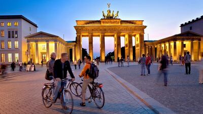 The historic Brandenburg Gate is one of the best-known monuments in the newly revitalised West Berlin. Lucas Vallecillos / Alamy Stock Photo