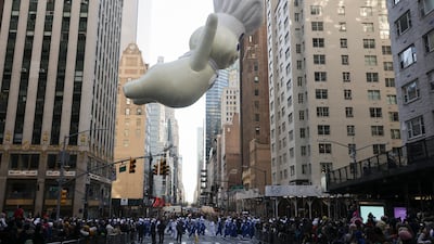 The Pillsbury Doughboy passes 57th Street. AP Photo