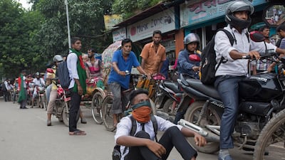 Students take position on a street to control motorists during a rally demanding safe roads on the seventh consecutive day of protests, in Dhaka city, Bangladesh. EPA / MONIRUL ALAM