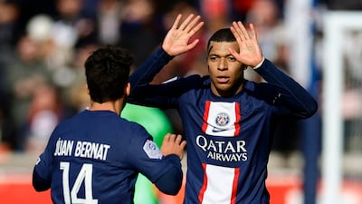 Kylian Mbappe celebrates scoring PSG's third goal with Juan Bernat. Reuters