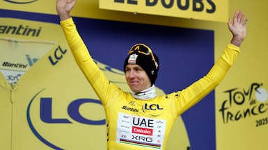 UAE Team Emirates XRG's Tadej Pogacar celebrates on the podium after Stage 20 of the 2025 Tour de France. Reuters