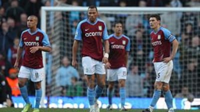 Aston Villa players, from left to right, Gabriel Agbonlahor, John Carew, Curtis Davies and Gareth Barry stand dejected after Stoke City's late rally on Sunday denied them victory in a 2-2 draw at Villa Park.