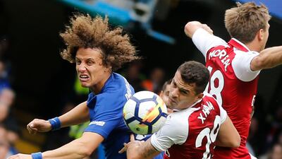David Luiz, Granit Xhaka, and Nacho Monreal, from left, jump to head the ball. Frank Augstein / AP Photo