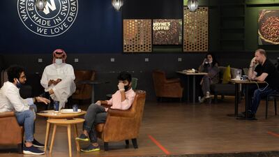 People sit at a cafe in a mall in Riyadh. AFP