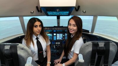 Lina Aziz (left) and Jolene Chuah Xuan who are currently completing their ground training to become commercial pilots at the Alpha Aviation Academy, Sharjah International Airport. Antonie Robertson / The National
