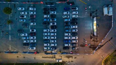 Cinema-goers watch a movie from their cars at a drive-in theater on the car park of a supermarket in Istanbul. AFP