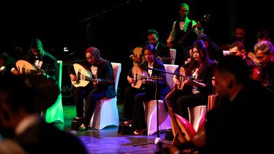 Oud players take part in a concert at Al Rasheed theatre in Baghdad