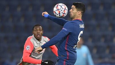 Atletico Madrid's Luis Suarez heads the ball. EPA