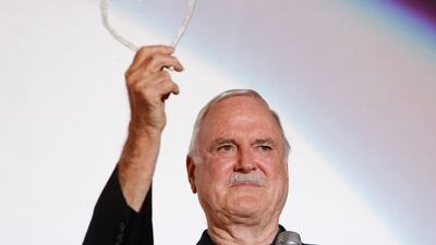 British actor John Cleese poses for photos with Sarajevo Film Festival's top honour award, the Heart of Sarajevo Award, in Sarajevo, Bosnia. Courtesy AP