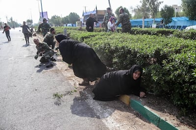 Iranian soldiers, women, and children lay down and run during a terror attack that occurred at military parade in the city of Ahvaz, southern Iran. EPA