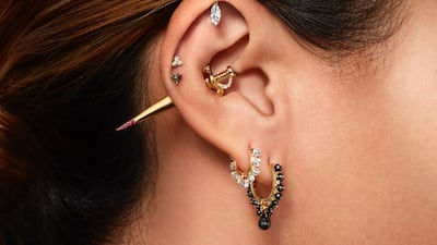 White and black diamond sword with ruby drops earring, Dh4,003. Maria Tash. Photo: Maria Tash