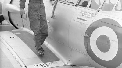 The Duke of Edinburgh disembarks from a Harvard Trainer aircraft after a flight, at RAF White Waltham, Berkshire, where he had been training for his 'wings', on May 4, 1953. Getty Images