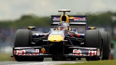 Red Bull's Sebastian Vettel clocks a time of one minute 19.509 seconds to take pole for this year's British Grand Prix.