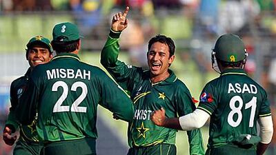 Saeed Ajmal, the Pakistan spinner, second right, celebrates the wicket of Devendra Bishoo with his teammates during the West Indies collapse.