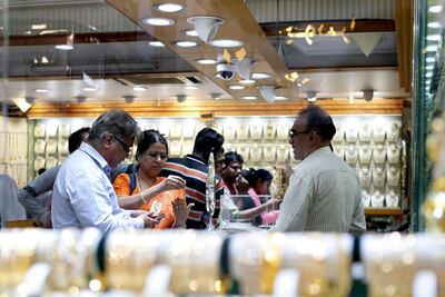 People browse in a shop in the Gold Souk area of Deira in Dubai. Christopher Pike / The National