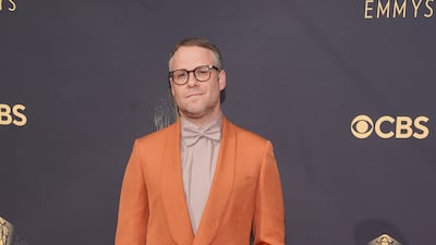 Seth Rogen in an orange Brioni jacket. AP