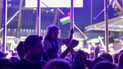 Spectators prepare to watch the fireworks display for UAE's 51st National Day on Al Maryah Island, Abu Dhabi. Khushnum Bhandari / The National
