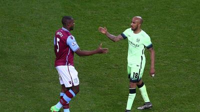 Fabian Delph of Manchester City and Jores Okore of Aston Villa go to shake hands after their FA Cup match on Saturday. Michael Steele / Getty Images